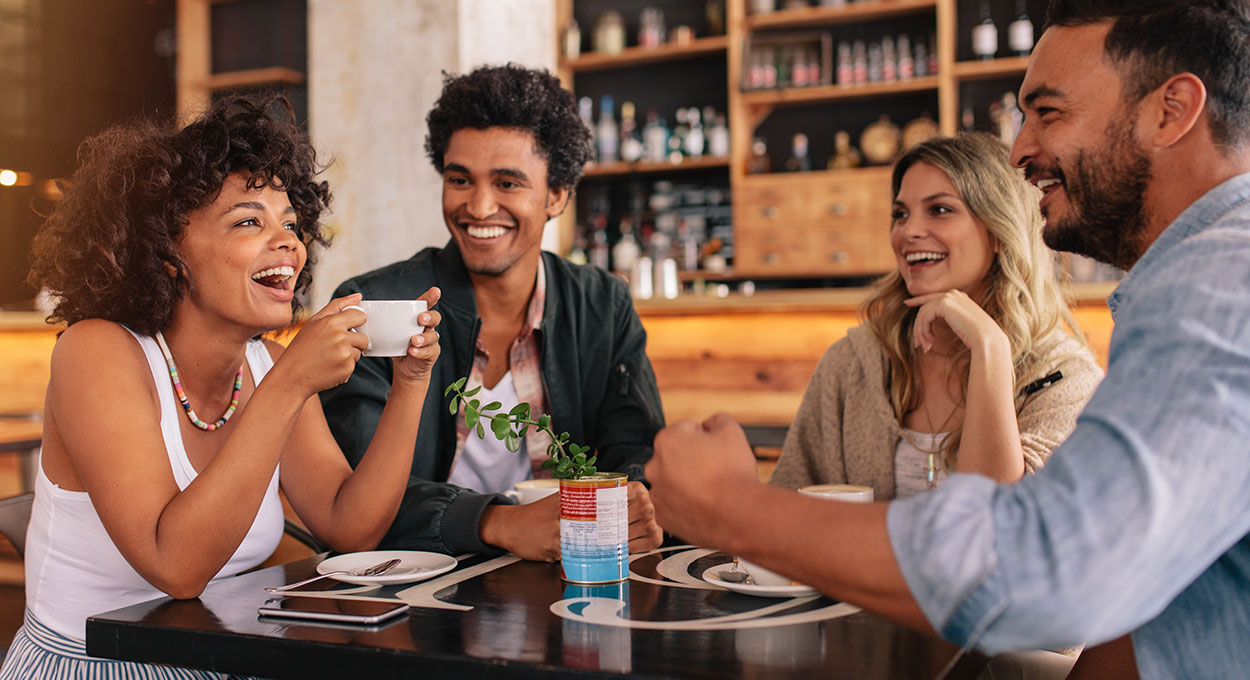 Young friends having a great time in cafe